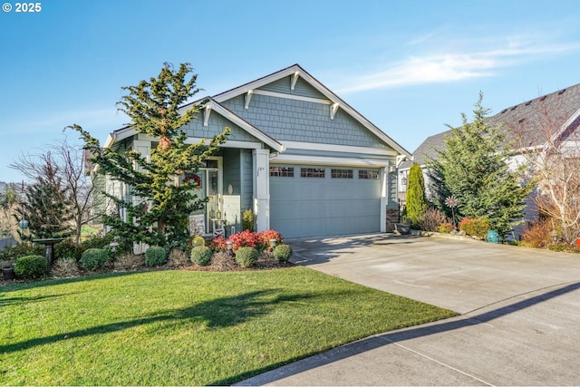 craftsman inspired home featuring a garage and a front yard