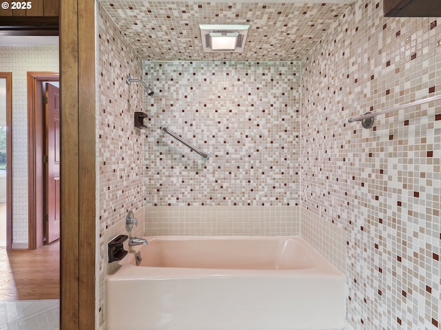 bathroom featuring shower / bathtub combination and visible vents
