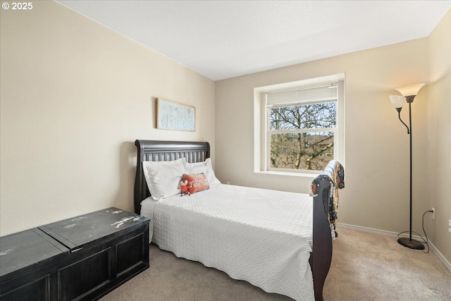 bedroom with carpet flooring and baseboards