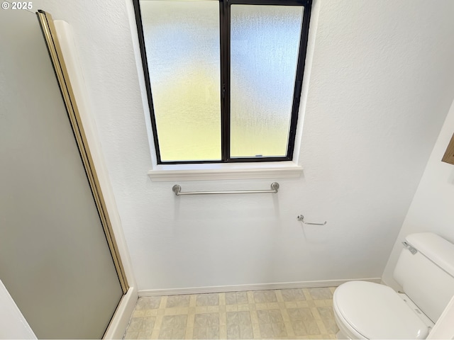 543 Linda Ln, Brookings, OR 97415 - full bathroom with toilet, baseboards, tile patterned floors, and a stall shower