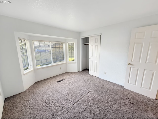 543 Linda Ln, Brookings, OR 97415 - unfurnished bedroom featuring carpet flooring and a closet