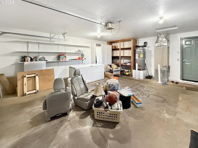 543 Linda Ln, Brookings, OR 97415 - garage with secured water heater, a garage door opener, and heating unit