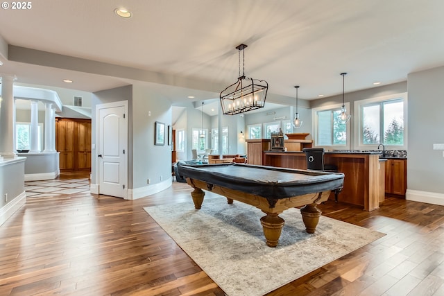 game room featuring ornate columns, pool table, wood finished floors, and recessed lighting