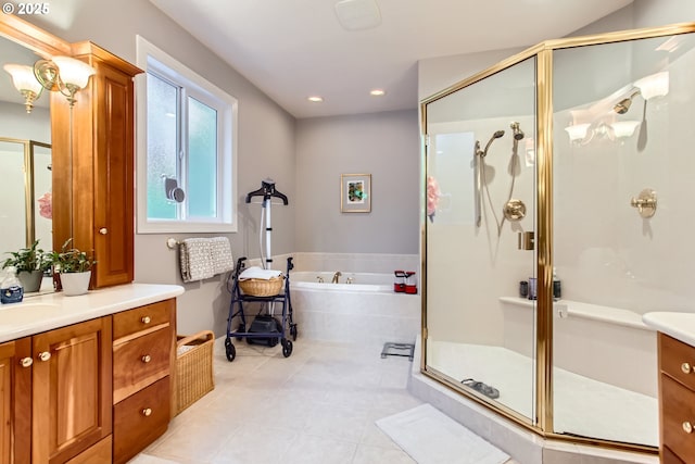 bathroom with a garden tub, recessed lighting, a shower stall, vanity, and tile patterned floors