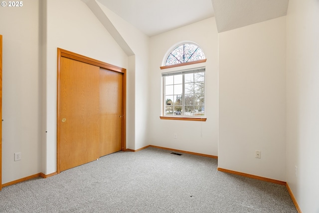 unfurnished bedroom featuring baseboards, visible vents, and carpet floors