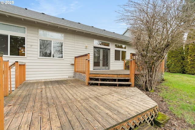 wooden deck with french doors and a yard