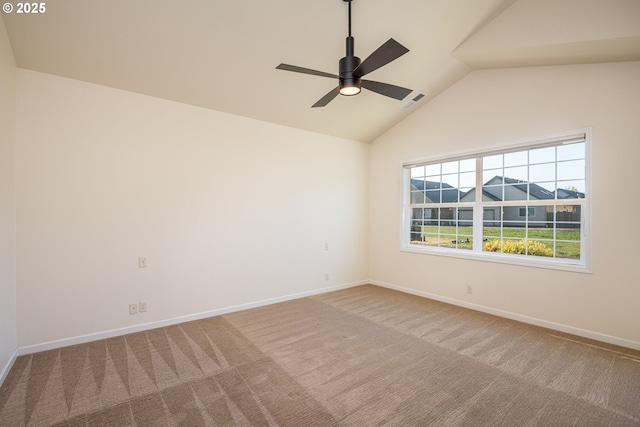 unfurnished room featuring baseboards, carpet flooring, vaulted ceiling, and visible vents