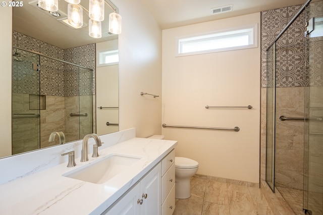 bathroom featuring vanity, visible vents, a wealth of natural light, and a stall shower