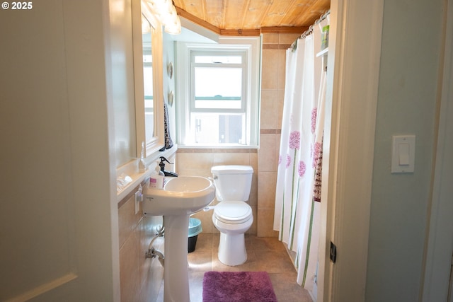 3710 SE 86th Ave, Portland, OR 97266 - bathroom featuring tile walls, toilet, wood ceiling, tile patterned floors, and ornamental molding