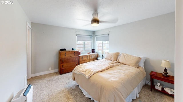 97997 Olsen Ln, Brookings, OR 97415 - bedroom featuring light colored carpet, ceiling fan, and baseboards