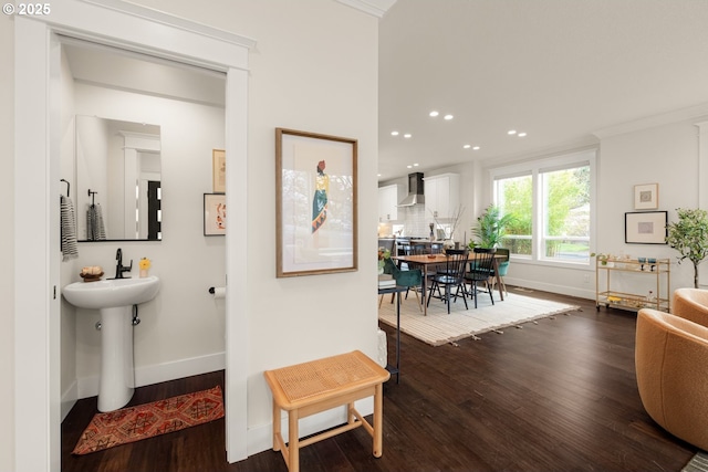 interior space with dark wood finished floors, recessed lighting, and baseboards