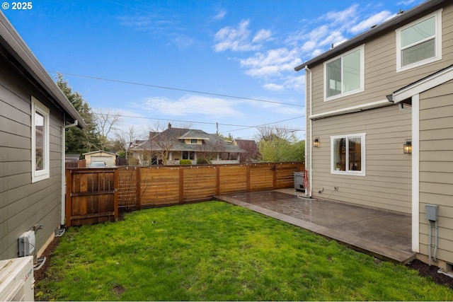 view of yard featuring a patio area and a fenced backyard