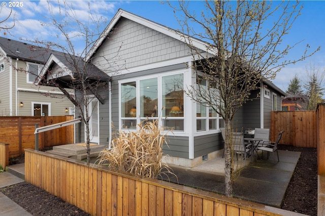 back of house featuring a patio and fence private yard