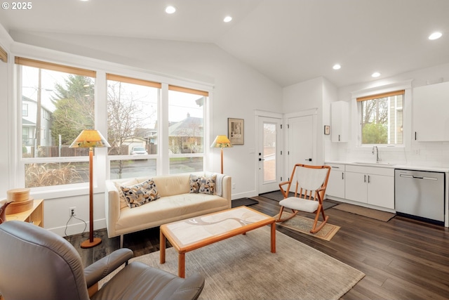 living area with lofted ceiling, recessed lighting, dark wood-style floors, and baseboards