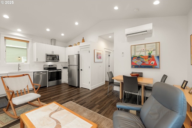 living area with baseboards, dark wood finished floors, vaulted ceiling, recessed lighting, and a wall mounted AC