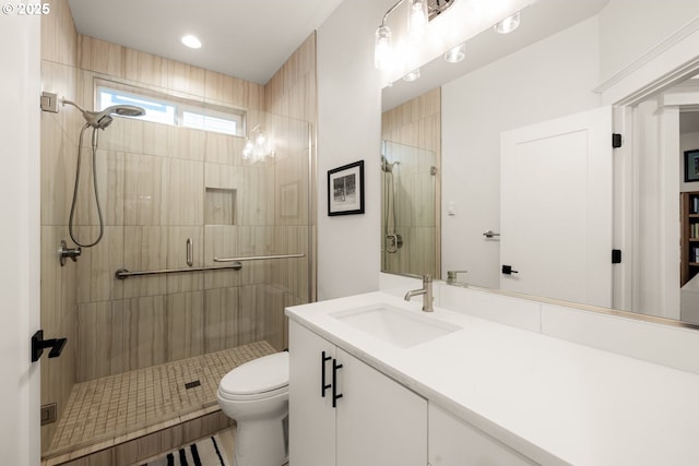 full bath featuring recessed lighting, a shower stall, toilet, and vanity