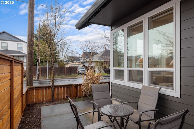 view of patio / terrace featuring outdoor dining area and fence