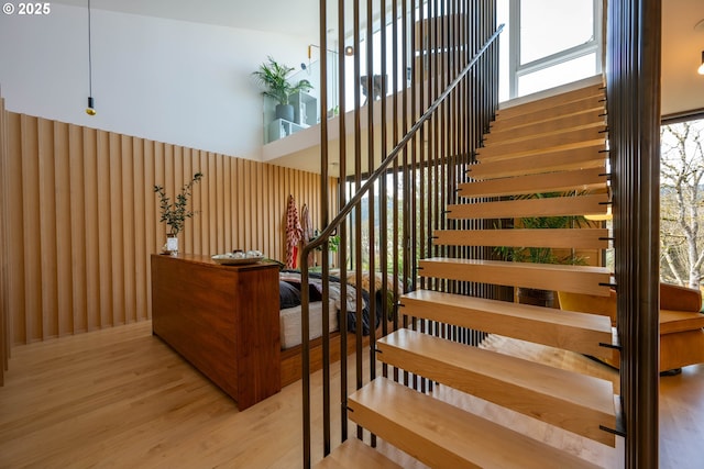 stairway with wood finished floors