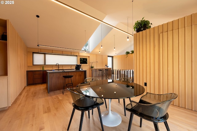dining room with light wood-style flooring