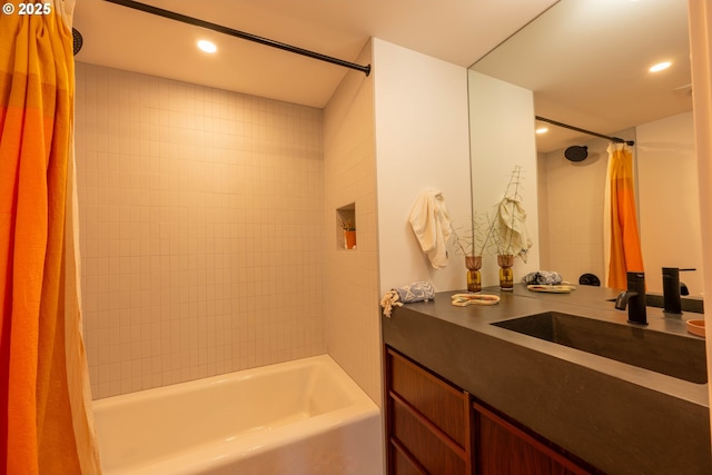 bathroom featuring recessed lighting, vanity, and shower / bathtub combination with curtain
