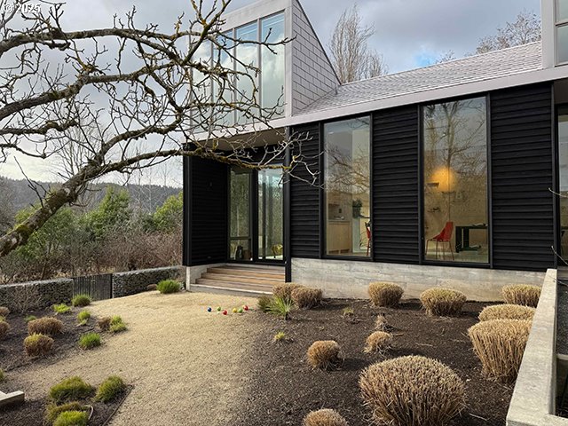 back of house featuring entry steps