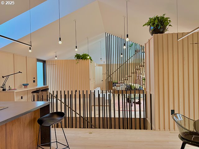 interior space with lofted ceiling and wood finished floors