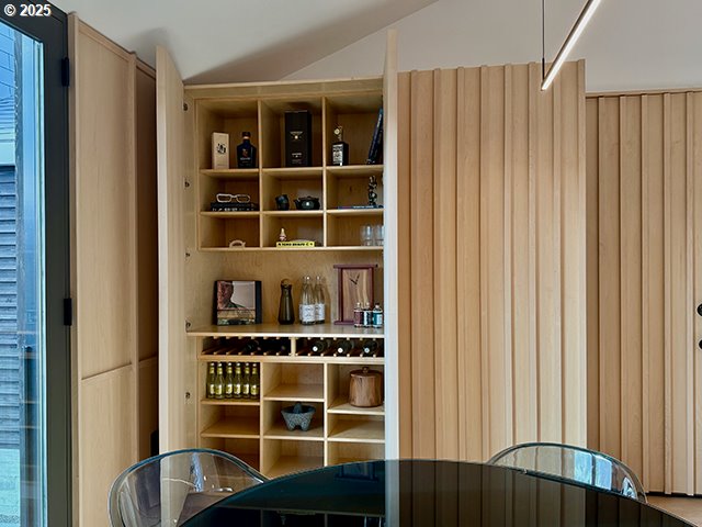 wine area featuring lofted ceiling