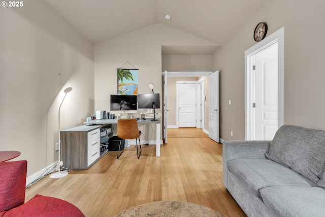 office featuring light wood-style flooring and lofted ceiling