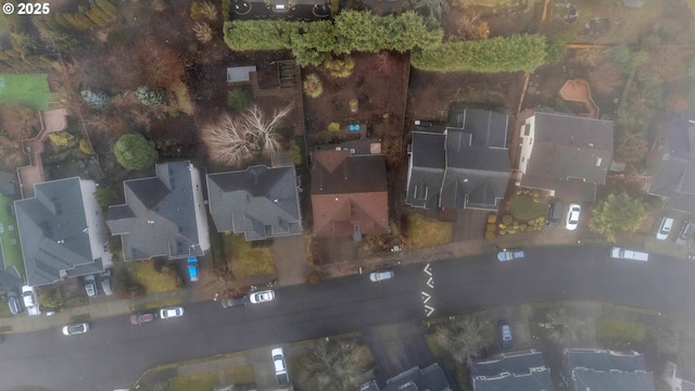 aerial view of property and surrounding area featuring nearby suburban area