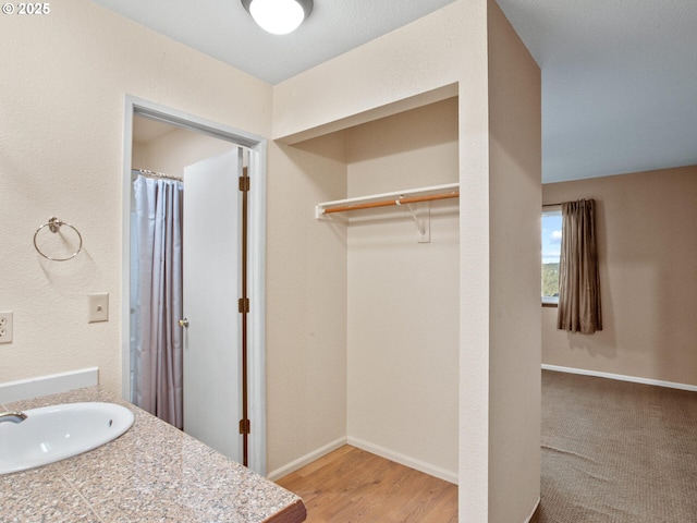 bathroom featuring vanity and hardwood / wood-style flooring