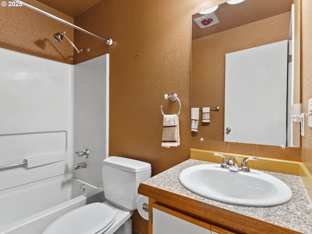 full bathroom featuring toilet, vanity, and tub / shower combination