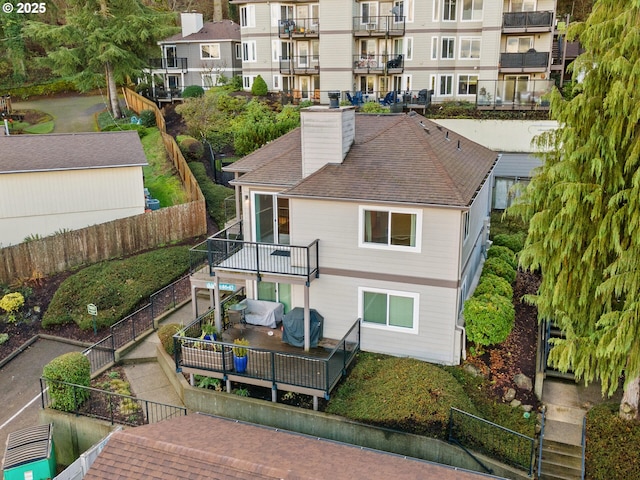 back of property featuring a balcony