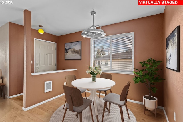 dining area with light wood-type flooring