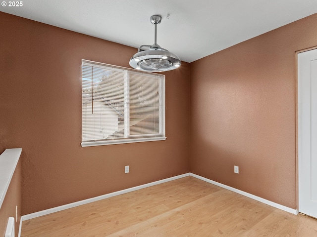 unfurnished dining area with wood-type flooring