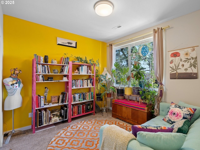 sitting room featuring carpet flooring