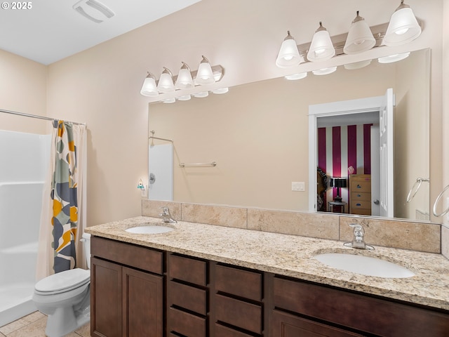 bathroom with vanity, curtained shower, and toilet