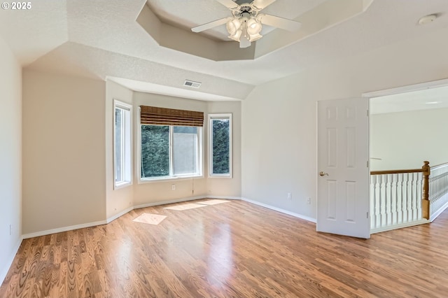 10939 SE Valley Way, Happy Valley, OR 97086 - empty room featuring wood finished floors, a tray ceiling, a smoke detector, and a ceiling fan
