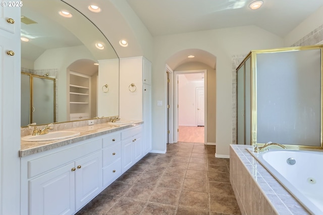 10939 SE Valley Way, Happy Valley, OR 97086 - full bathroom featuring vaulted ceiling, a shower stall, a whirlpool tub, double vanity, and recessed lighting