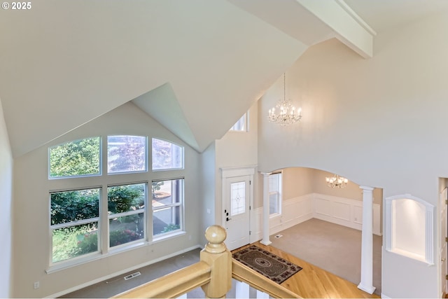10939 SE Valley Way, Happy Valley, OR 97086 - foyer with a chandelier, wood finished floors, high vaulted ceiling, and arched walkways