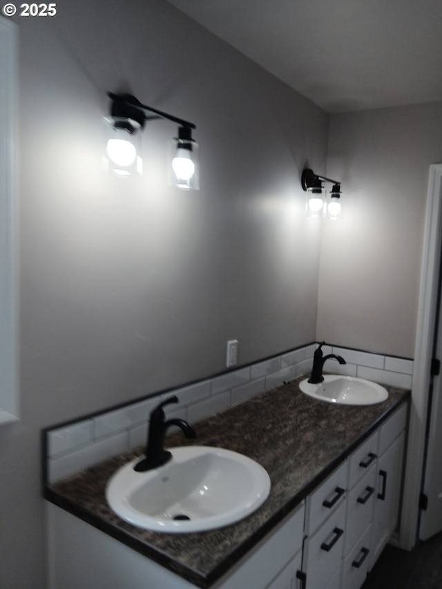 bathroom with double vanity and a sink