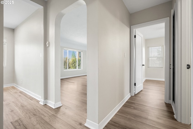 hallway with light hardwood / wood-style flooring