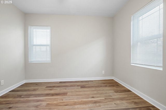 unfurnished room featuring light wood-type flooring