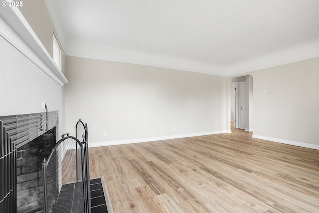 unfurnished living room featuring light wood-type flooring