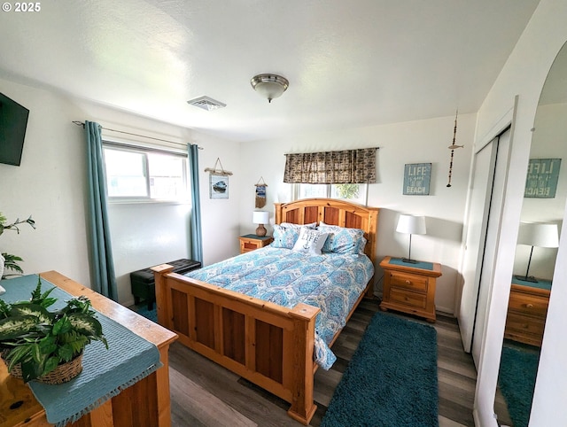96335 Dawson Rd, Brookings, OR 97415 - bedroom featuring visible vents, wood finished floors, and a closet