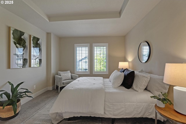 carpeted bedroom with baseboards