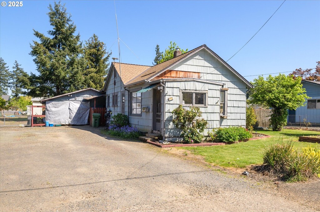 view of front of house with fence and a chimney