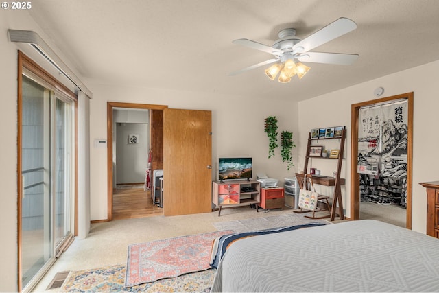 bedroom with light carpet, multiple windows, and ceiling fan