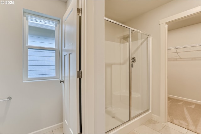 865 Legacy St, Eugene, OR 97402 - full bath with a stall shower, a walk in closet, baseboards, and tile patterned flooring