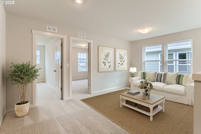 living room with light colored carpet