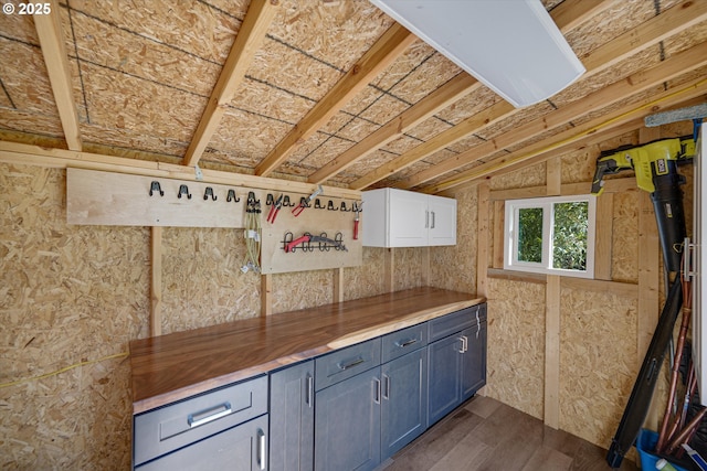 15525 SW Hearth Ct, Beaverton, OR 97007 - kitchen featuring dark wood finished floors, wood counters, and lofted ceiling